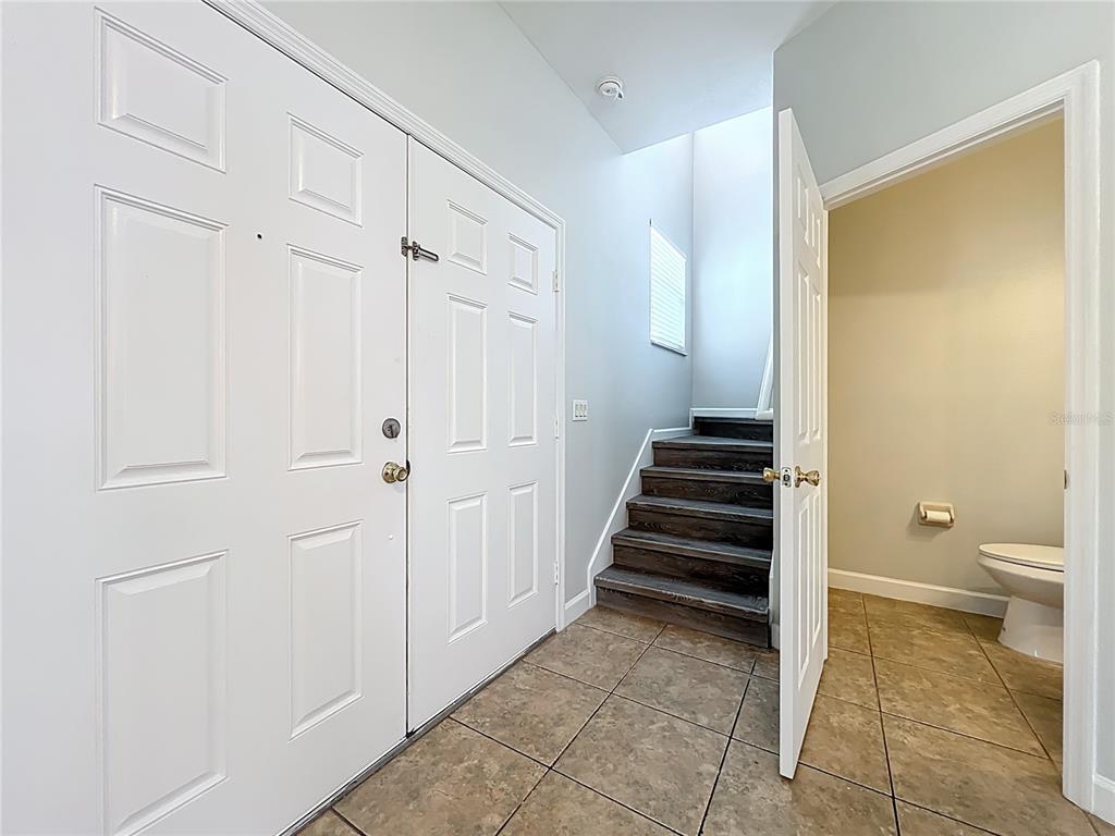 16178 Old Ash Loop Orlando, FL 32828 - Photo 6 of 58 a view of a hallway with a elevator and a bathroom