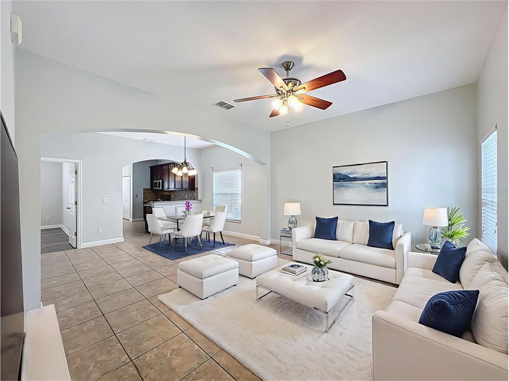 16178 Old Ash Loop Orlando, FL 32828 - Photo 8 of 58 a living room with furniture and a chandelier