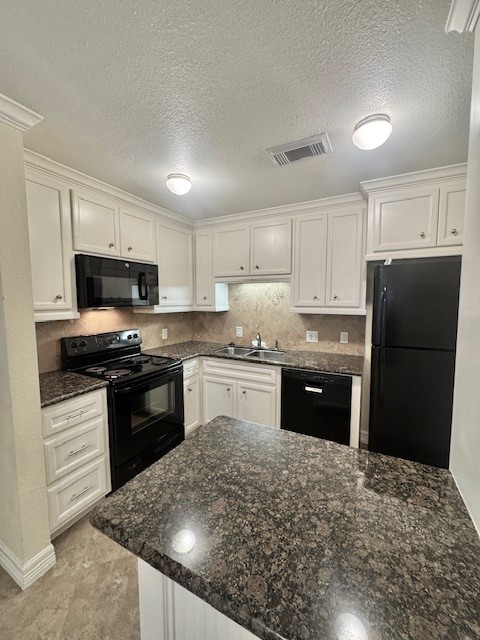 14020 Schroeder Road, Unit 151 Houston, TX 77070 - Photo 7 of 26 a kitchen with granite countertop a refrigerator stove and sink