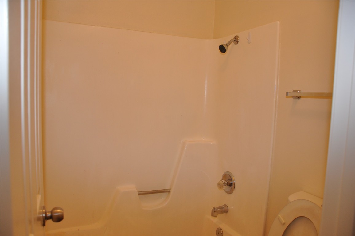 10810 Topperwein Drive, Unit C Austin, TX 78758 - Photo 11 of 11 Full bathroom featuring bathing tub / shower combination and toilet