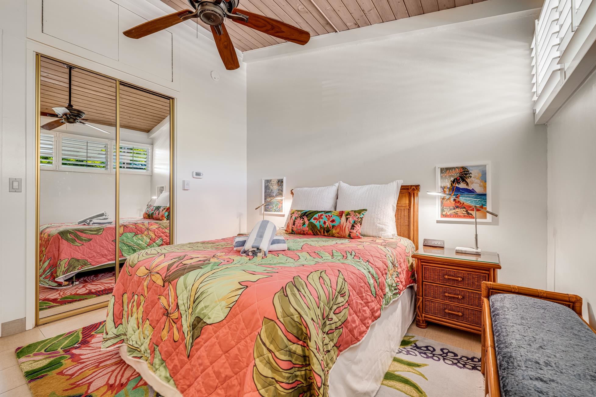 5315 Lower Honoapiilani Road, Unit F249 Lahaina, HI 96761 - Photo 14 of 33 a bedroom with a bed and wooden floor