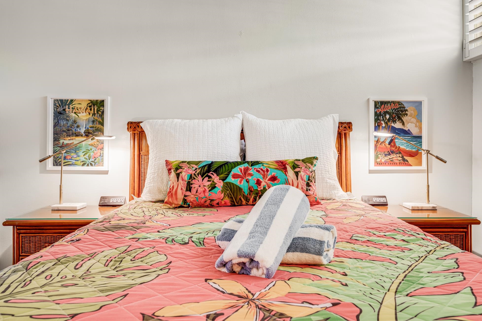 5315 Lower Honoapiilani Road, Unit F249 Lahaina, HI 96761 - Photo 19 of 33 a bedroom with a bed and painting on the wall