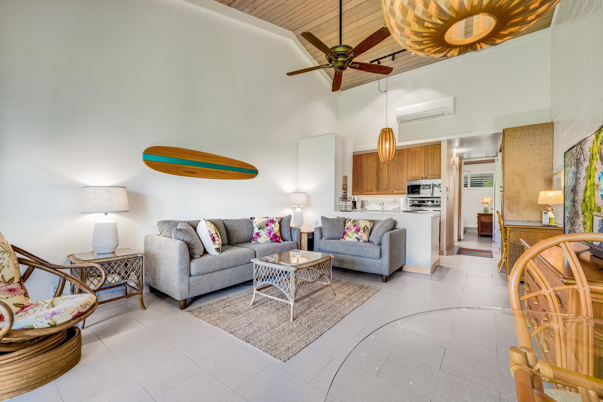 5315 Lower Honoapiilani Road, Unit F249 Lahaina, HI 96761 - Photo 3 of 33 a living room with furniture and a chandelier
