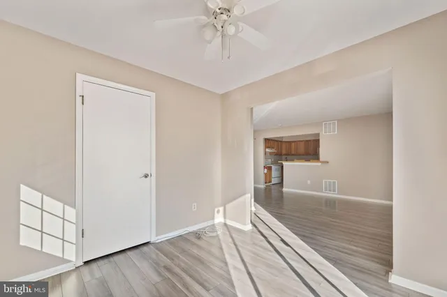 a kitchen with a sink a stove top oven and cabinetry