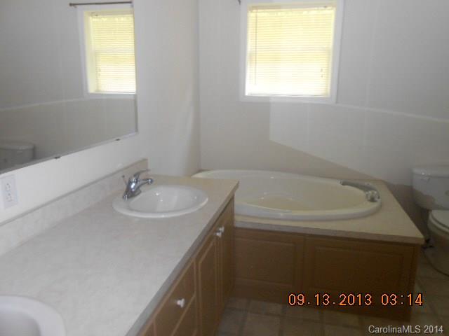 6226 Jesse Rushing Road Marshville, NC 28103 - Photo 7 of 10 a bathroom with a sink and a bathtub