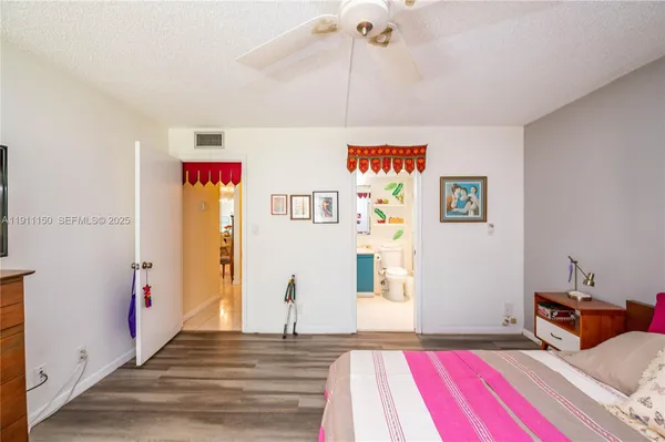 a bedroom with furniture and a bed