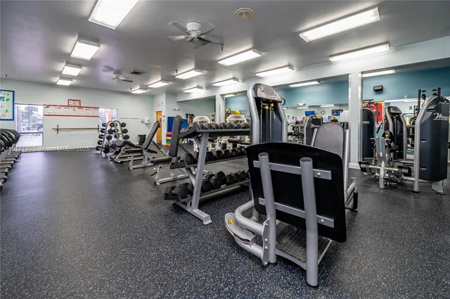 a bedroom with furniture and a flat screen tv