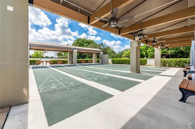 a view of a patio with swimming pool table and chairs