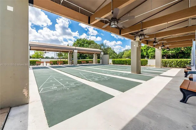 a view of a patio with swimming pool table and chairs