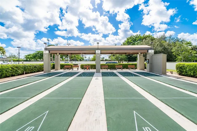 a view of a chair and table in the garden