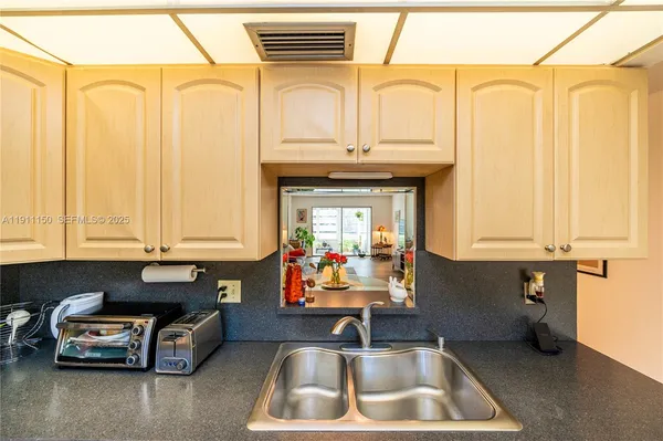 a kitchen that has a sink and a stove