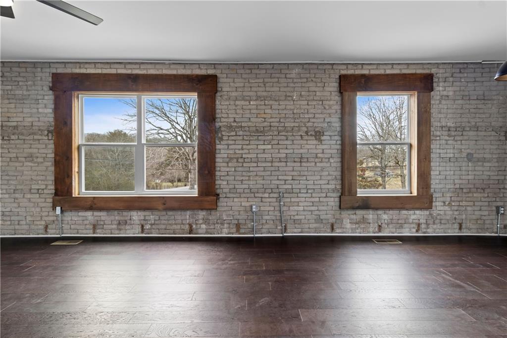 610 Madola Road, Unit 4 Epworth, GA 30541 - Photo 7 of 16 an empty room with wooden floor and windows