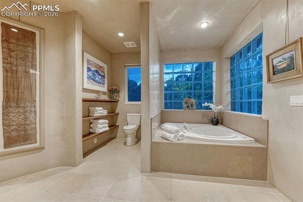 99 Bradburn Road Cotopaxi, CO 81223 - Photo 43 of 50 a bathroom with a tub sink and mirror