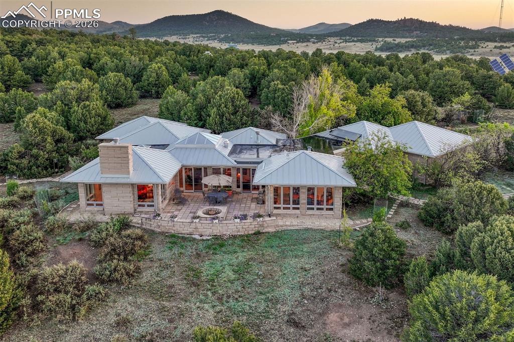 99 Bradburn Road Cotopaxi, CO 81223 - Photo 45 of 50 a view of a house with a yard and sitting area