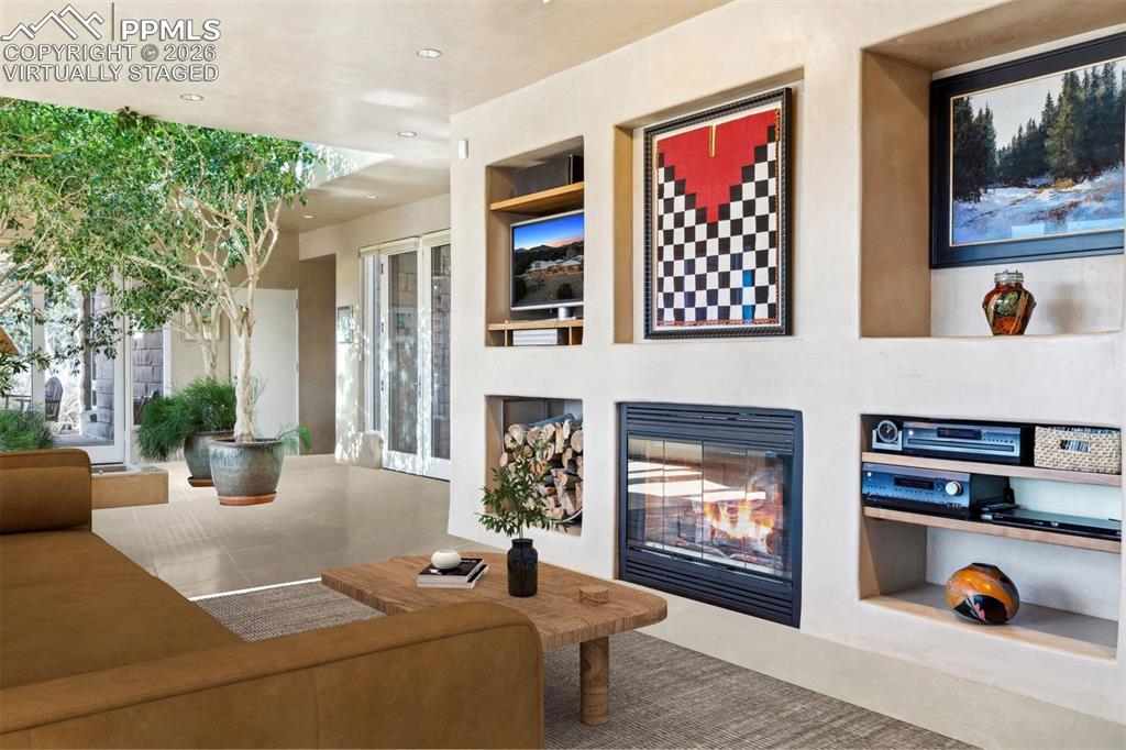 99 Bradburn Road Cotopaxi, CO 81223 - Photo 7 of 50 a living room with furniture a fireplace and windows
