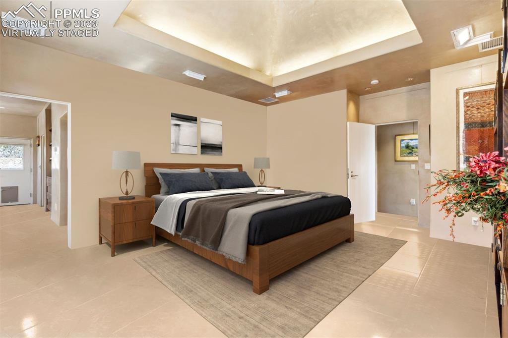 99 Bradburn Road Cotopaxi, CO 81223 - Photo 9 of 50 a bedroom with a large bed and potted plant