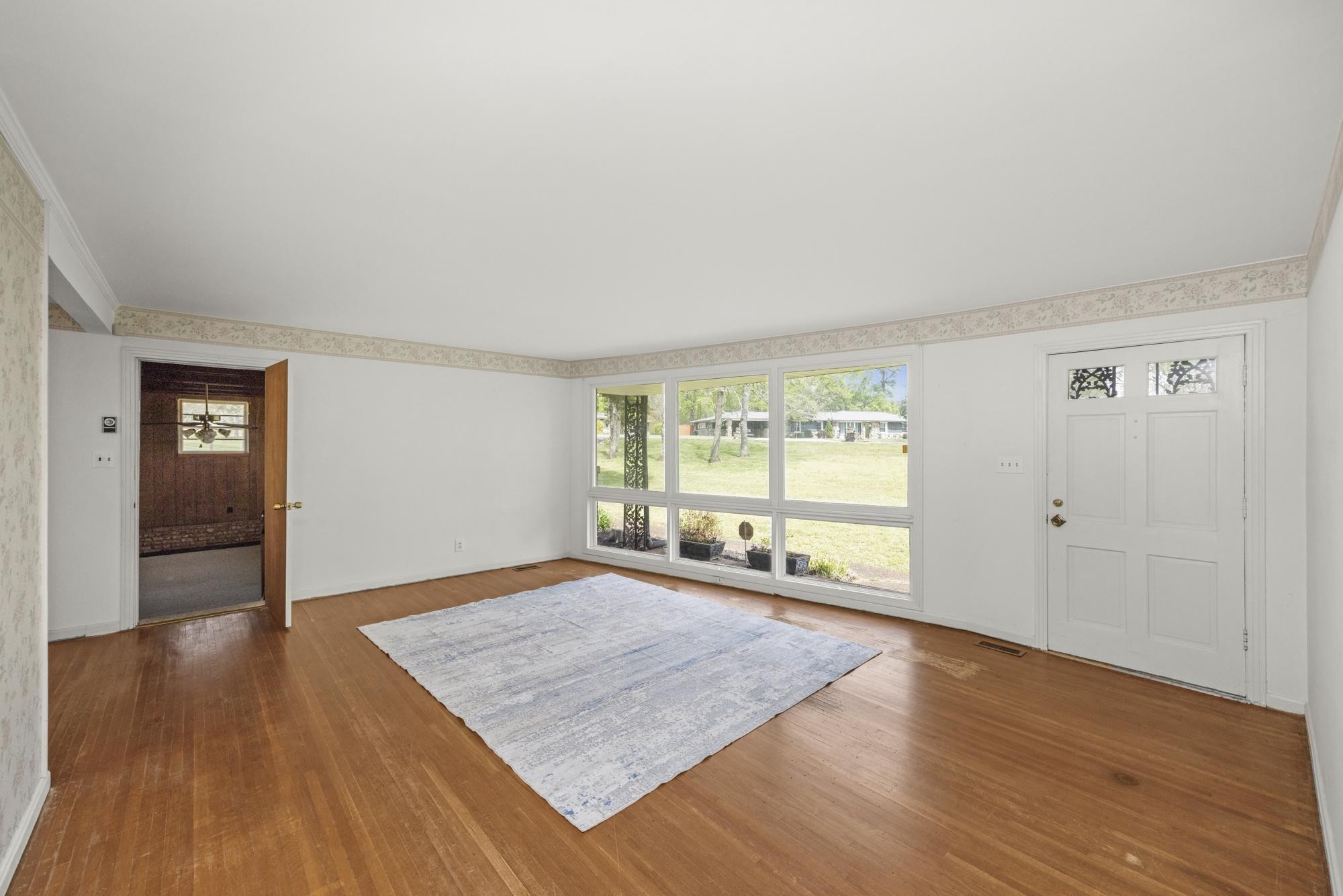 127 Riviera Drive Hendersonville, TN 37075 - Photo 19 of 46 an empty room with wooden floor and windows