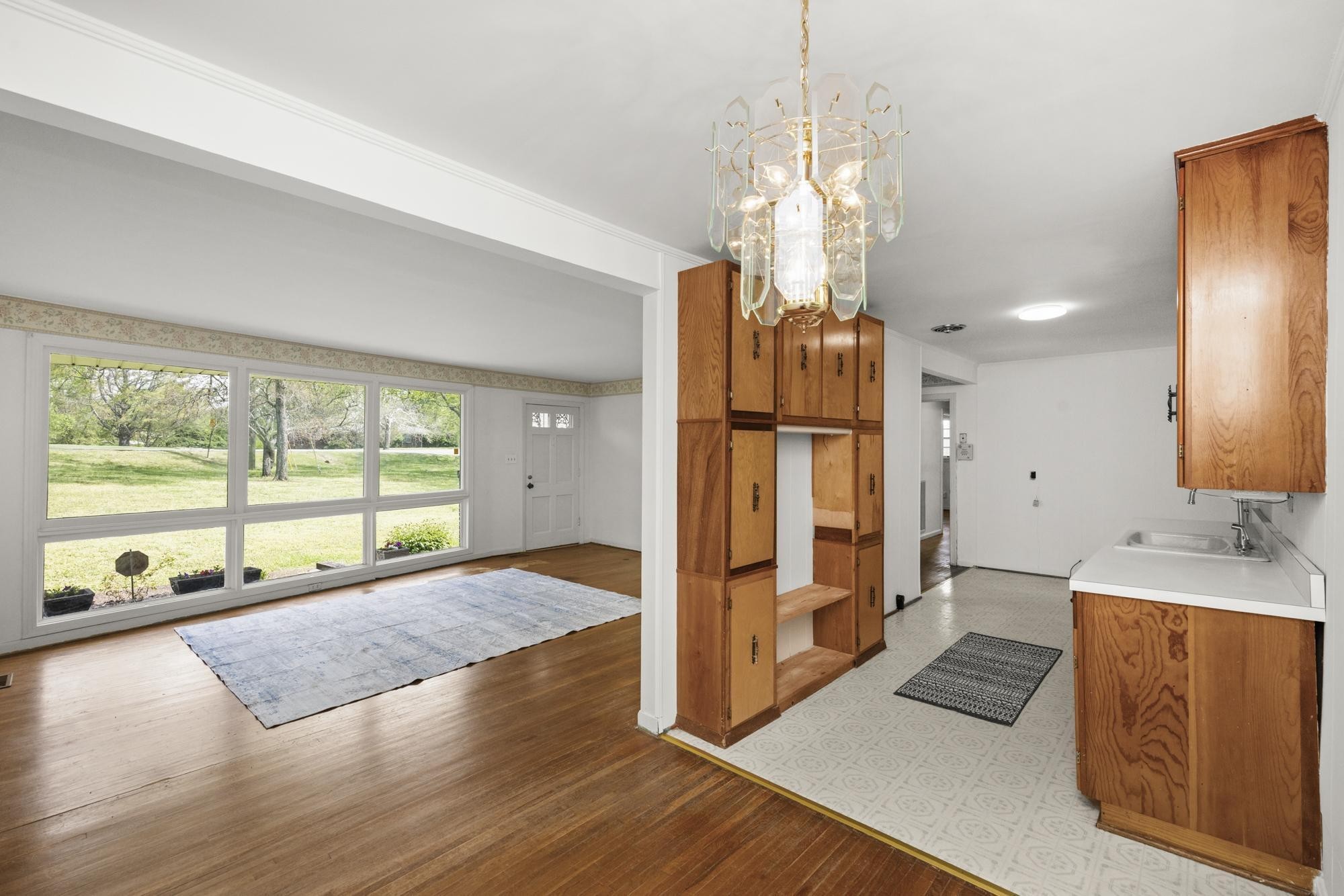 127 Riviera Drive Hendersonville, TN 37075 - Photo 23 of 46 a open kitchen with stainless steel appliances granite countertop a refrigerator a oven a island and a large window with wooden floor