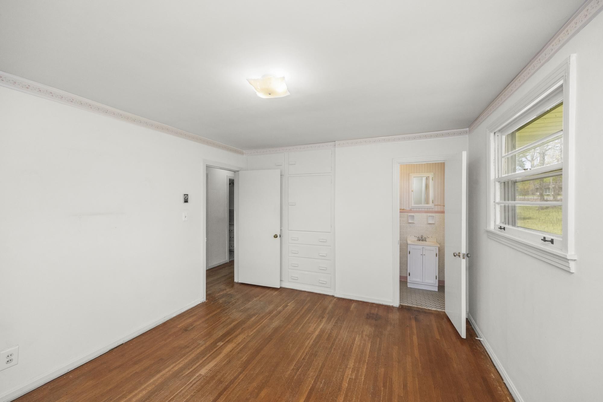 127 Riviera Drive Hendersonville, TN 37075 - Photo 32 of 46 an empty room with wooden floor and windows