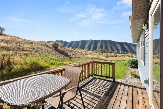 a view of balcony with wooden floor