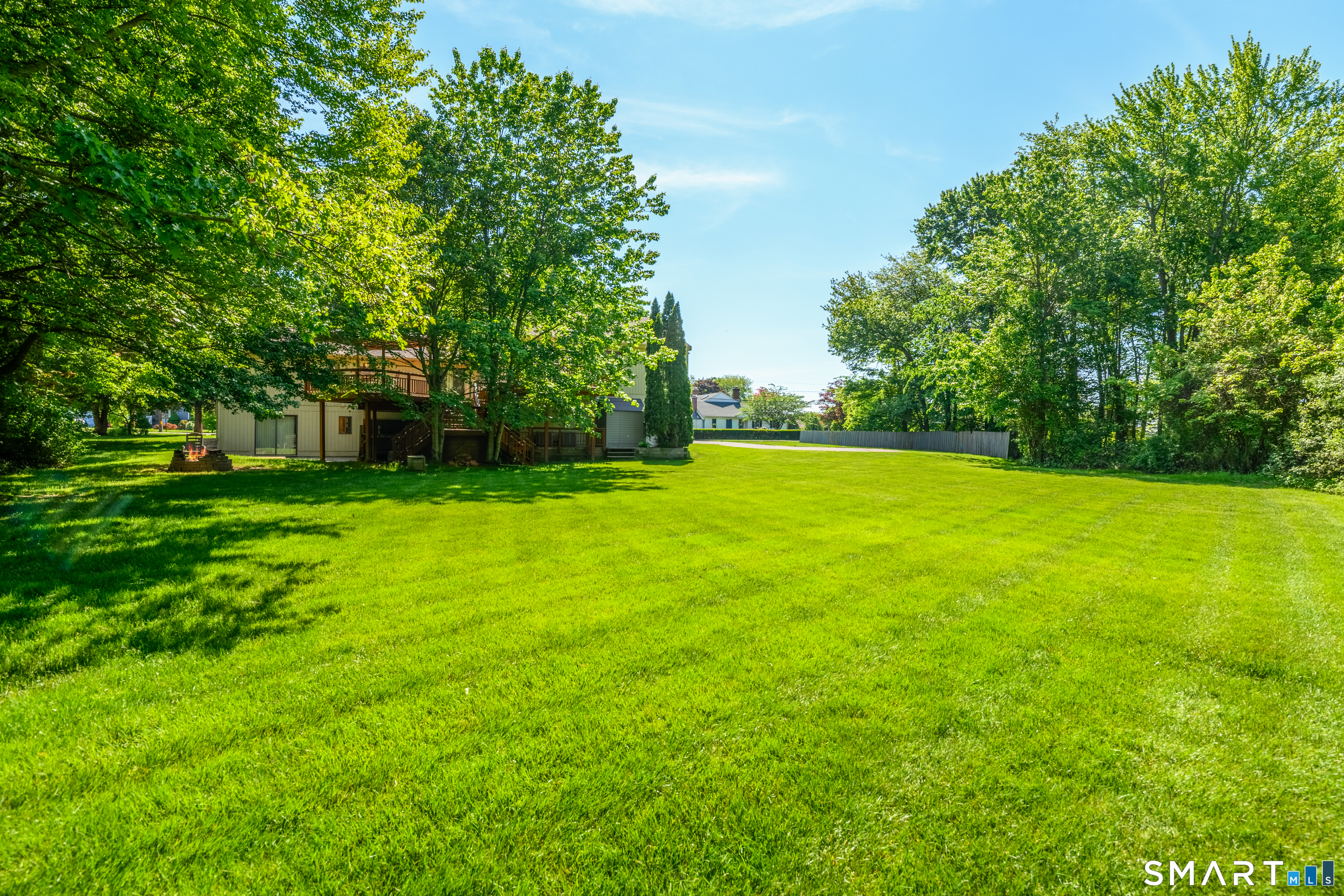 90 Bell Street Manchester, CT 06040 - Photo 3 of 40 a view of a big yard with swimming pool