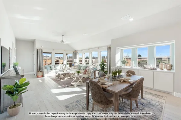 a living room with furniture dining area and a rug