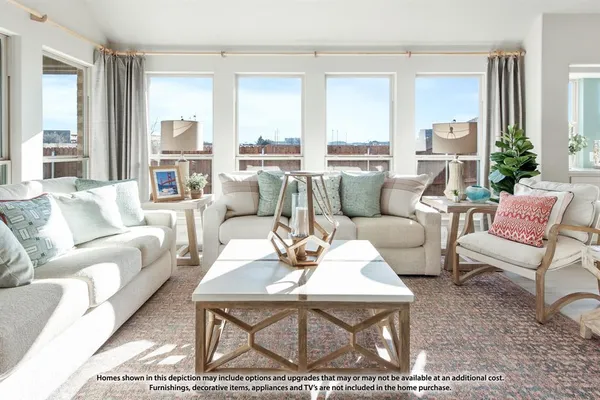 a living room with furniture dining table and a view of kitchen
