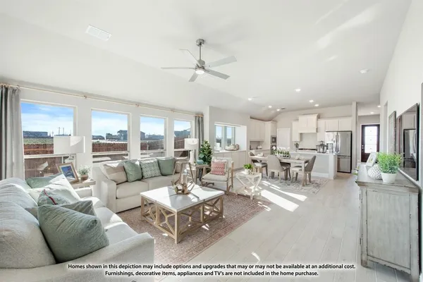 a living room with furniture a rug and a flat screen tv