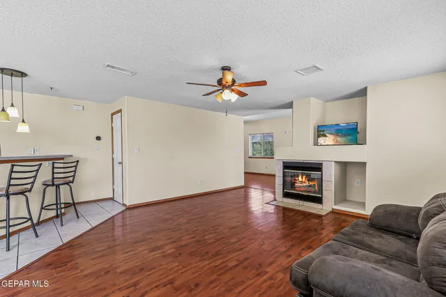 a kitchen with granite countertop cabinets and a refrigerator