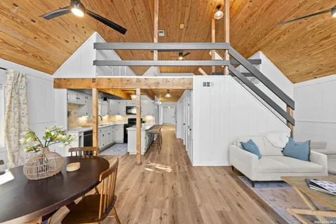a view of a dining room with furniture window and outside view