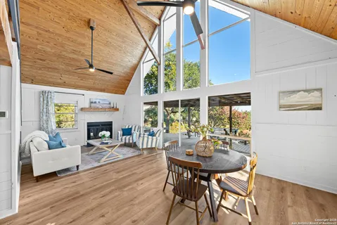 a kitchen with stainless steel appliances granite countertop a sink a stove and cabinets