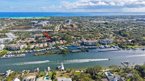 an aerial view of a city with ocean view