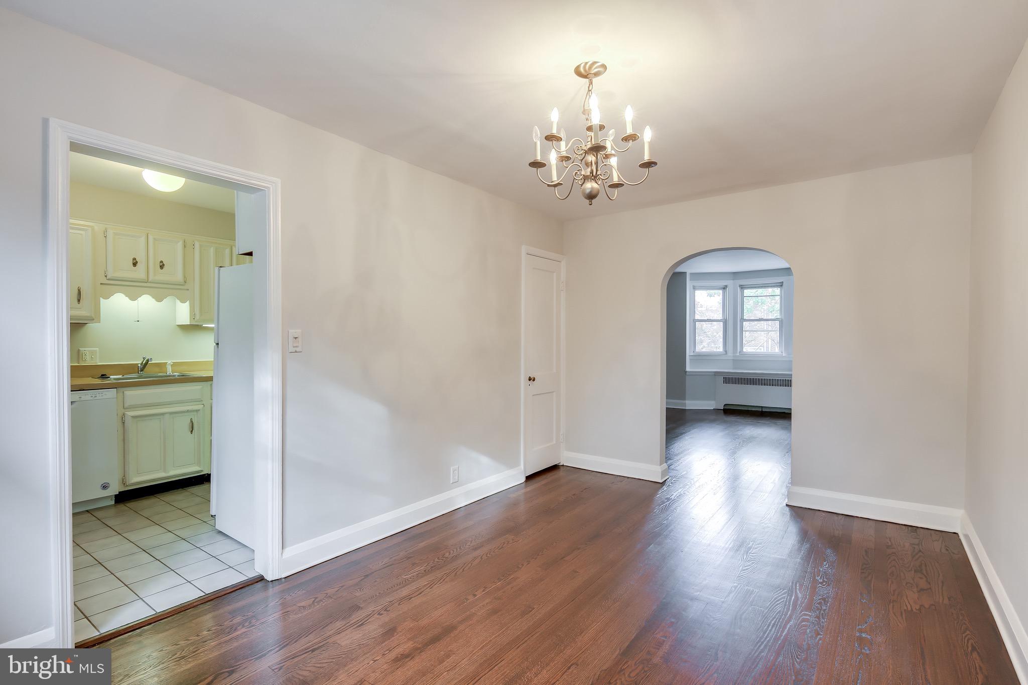 134 Cherrydell Road Baltimore, MD 21228 - Photo 11 of 36 wooden floor in an empty room with a window