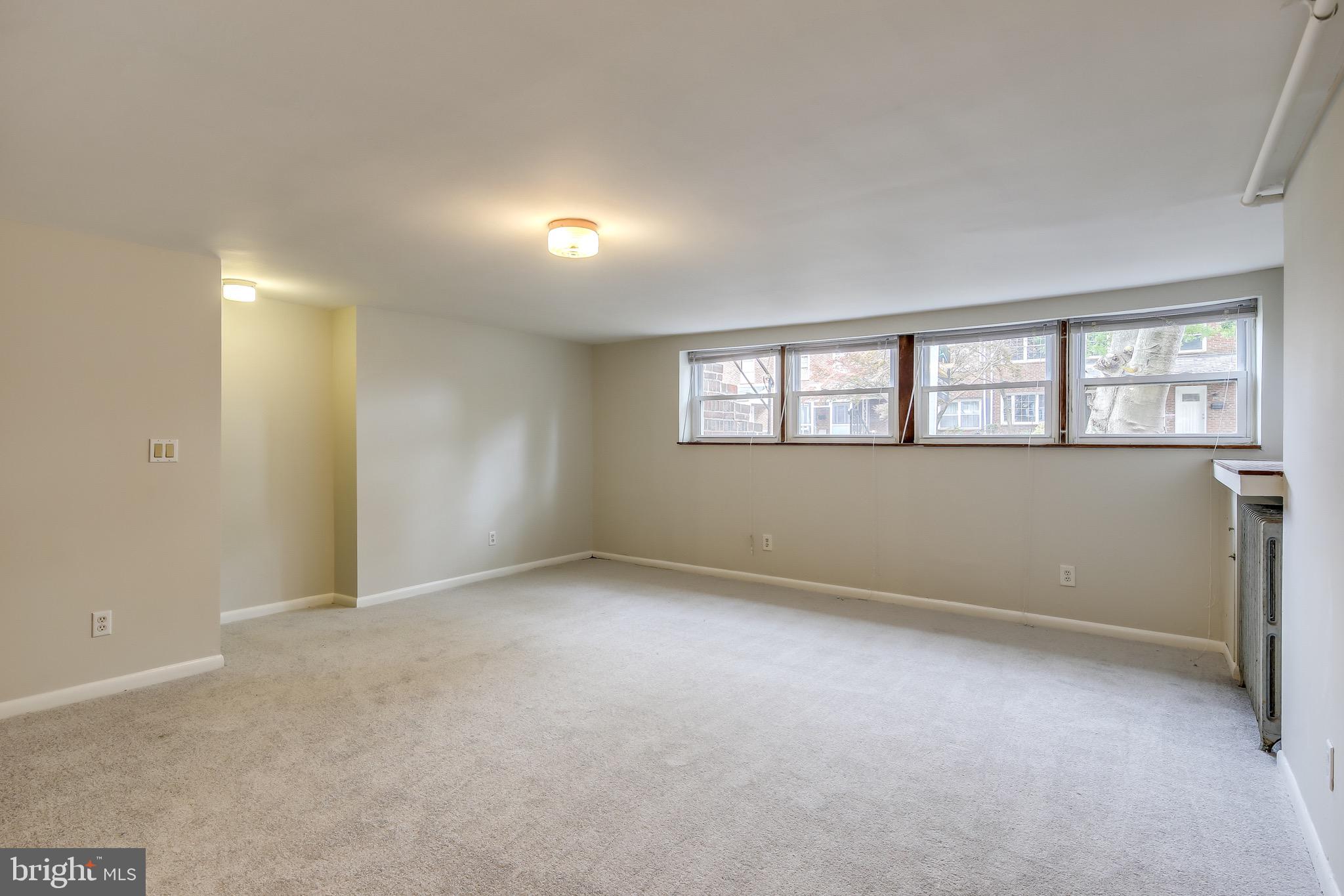 134 Cherrydell Road Baltimore, MD 21228 - Photo 18 of 36 an empty room with a empty space and windows