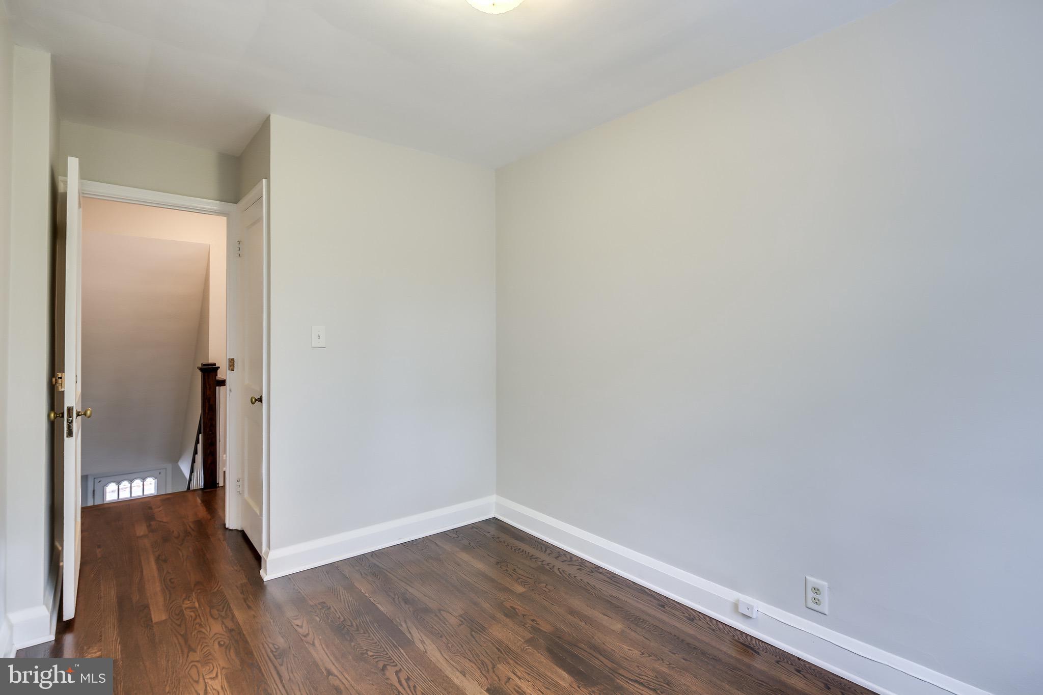 134 Cherrydell Road Baltimore, MD 21228 - Photo 21 of 36 a view of an empty room with wooden floor