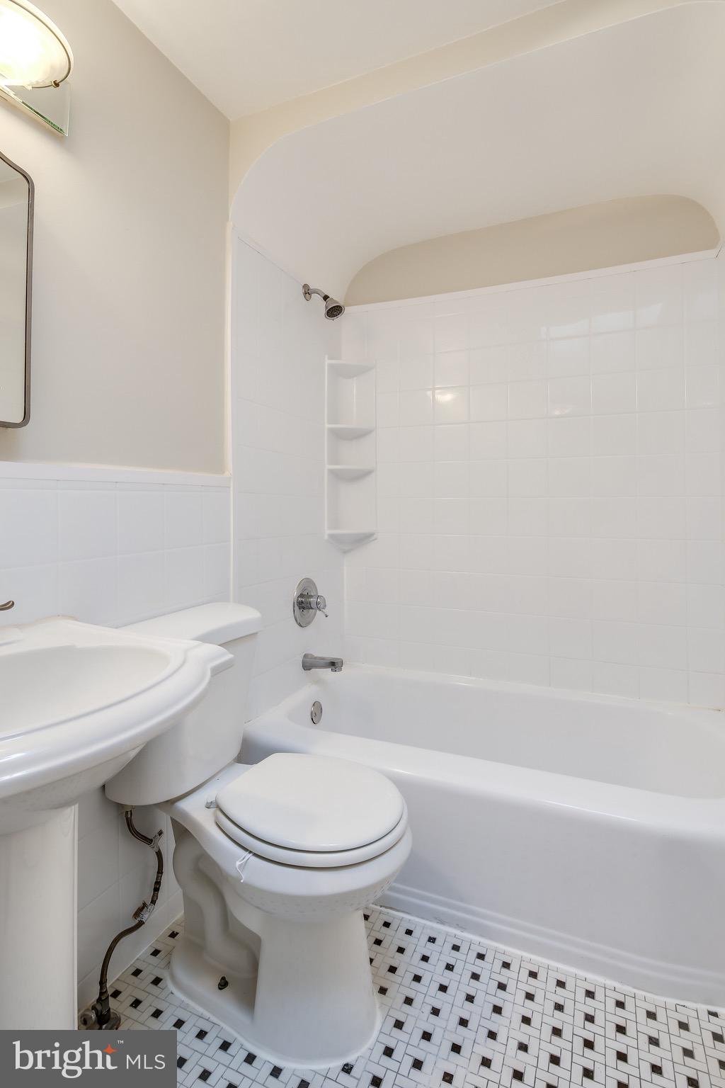 134 Cherrydell Road Baltimore, MD 21228 - Photo 26 of 36 a bathroom with a toilet a sink and a bathtub