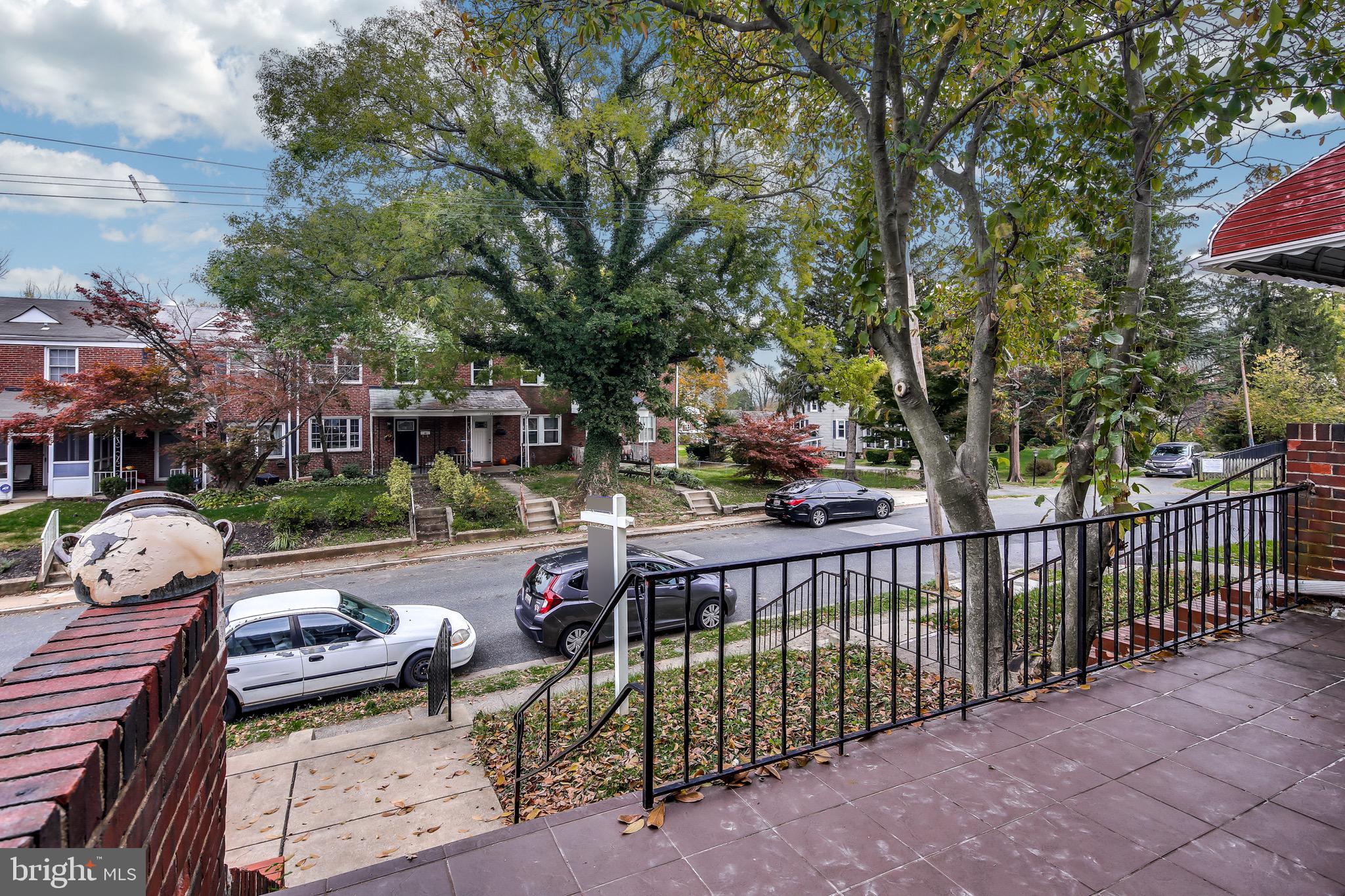 134 Cherrydell Road Baltimore, MD 21228 - Photo 5 of 36 a view of a wooden deck and a backyard