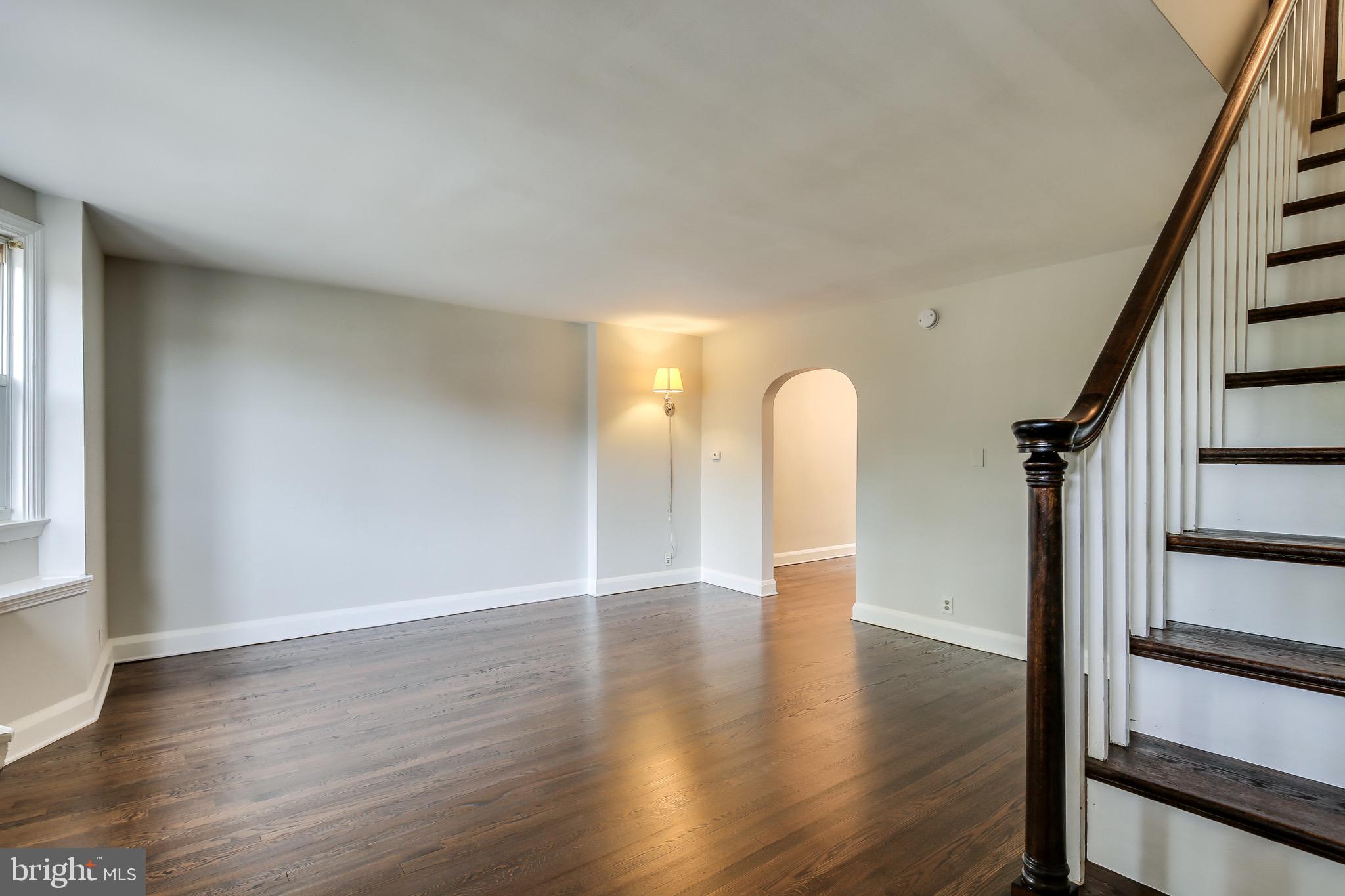134 Cherrydell Road Baltimore, MD 21228 - Photo 7 of 36 a view of a room with wooden floor and window