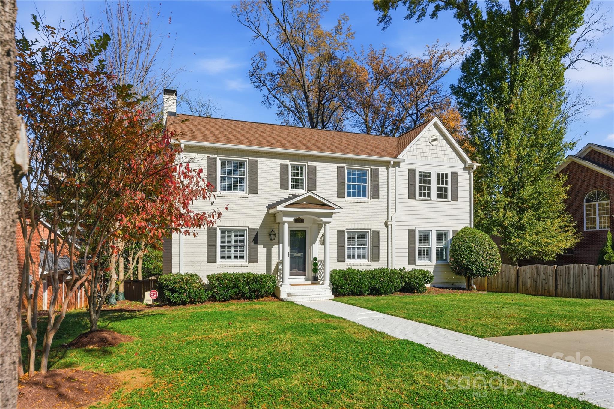 1305 Lilac Road Charlotte, NC 28209 - Photo 1 of 48 a front view of a house with a garden