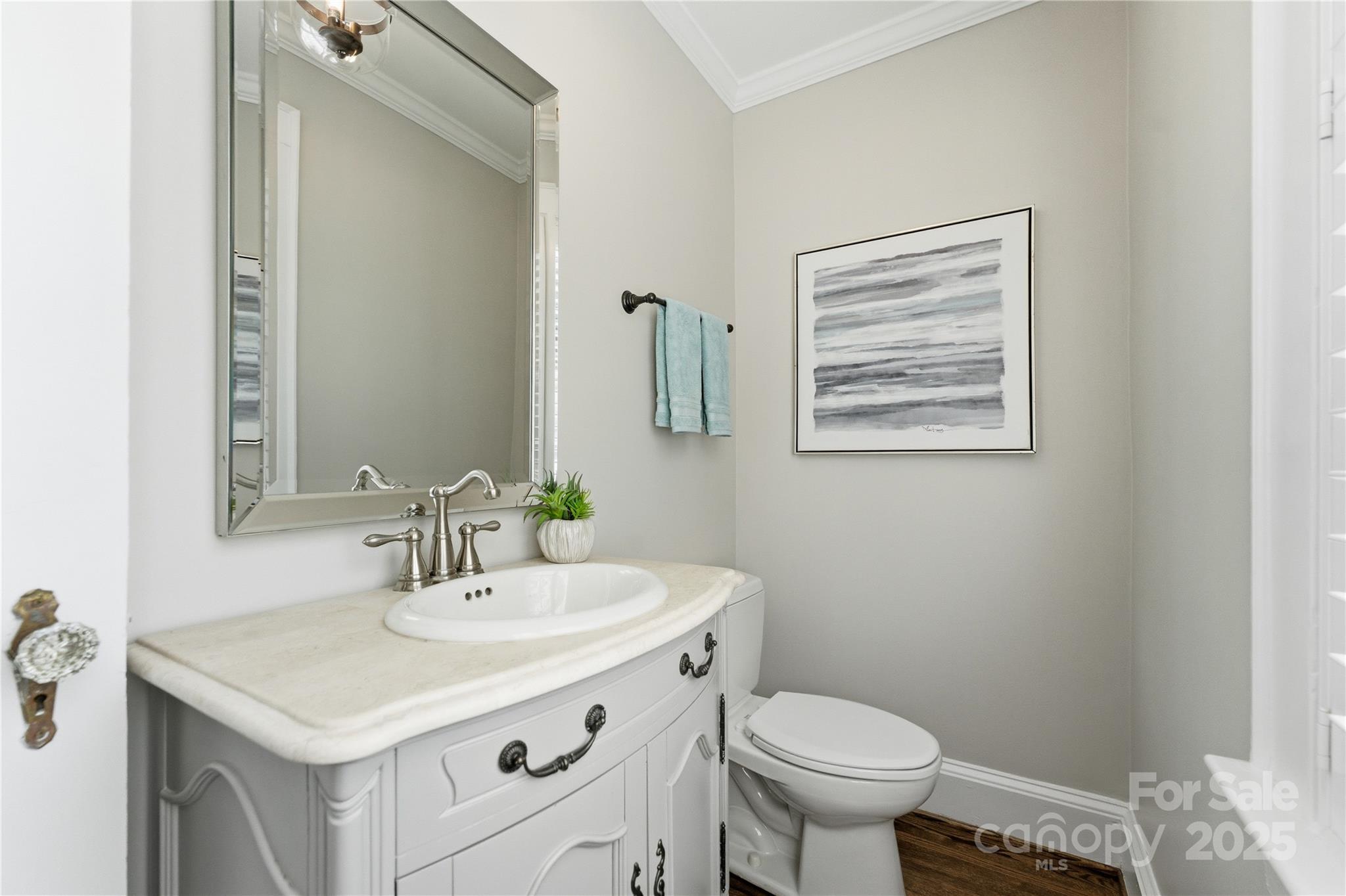 1305 Lilac Road Charlotte, NC 28209 - Photo 15 of 48 a bathroom with a sink toilet and a mirror
