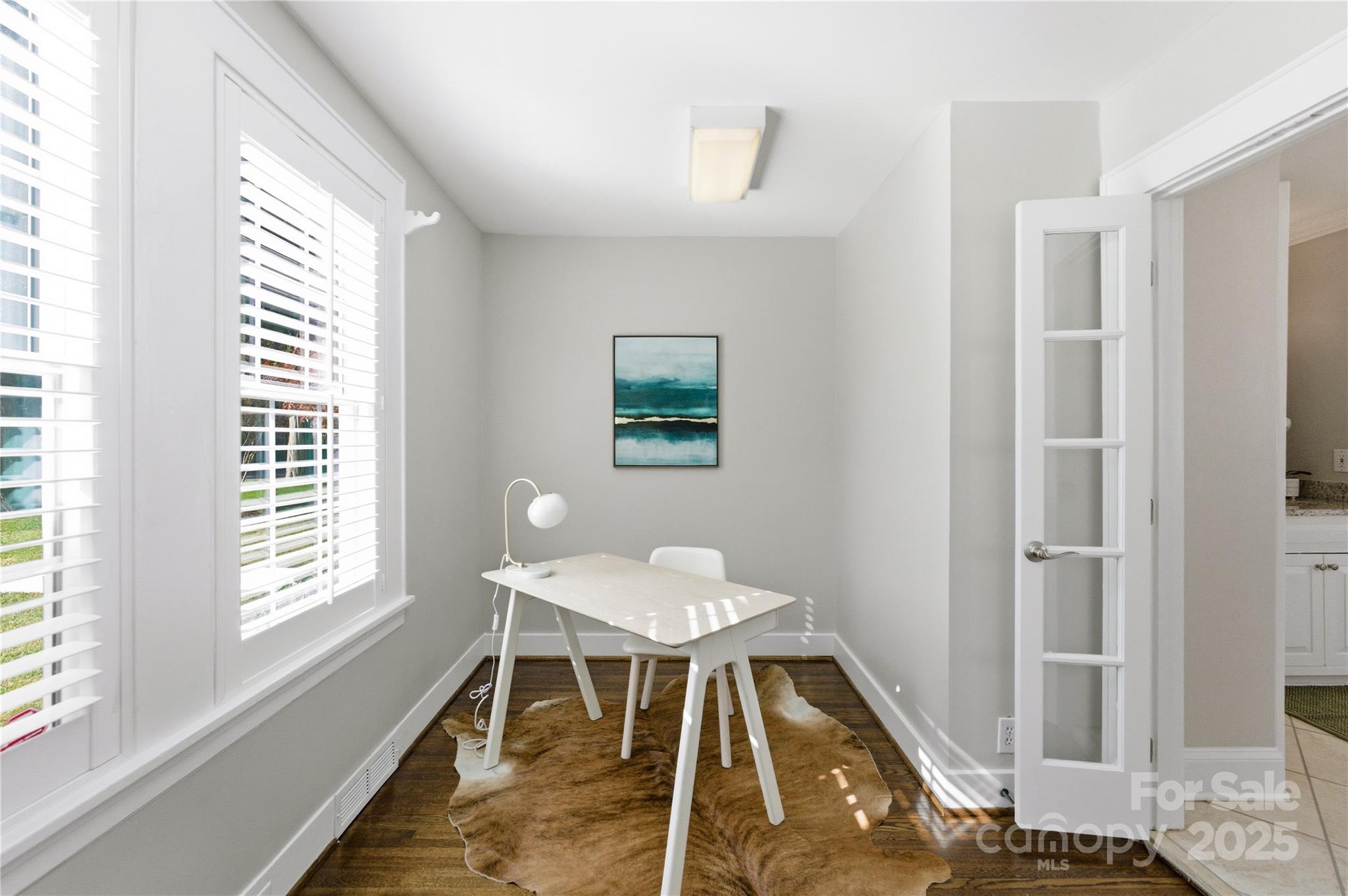 1305 Lilac Road Charlotte, NC 28209 - Photo 23 of 48 a workspace with wooden floor and a window