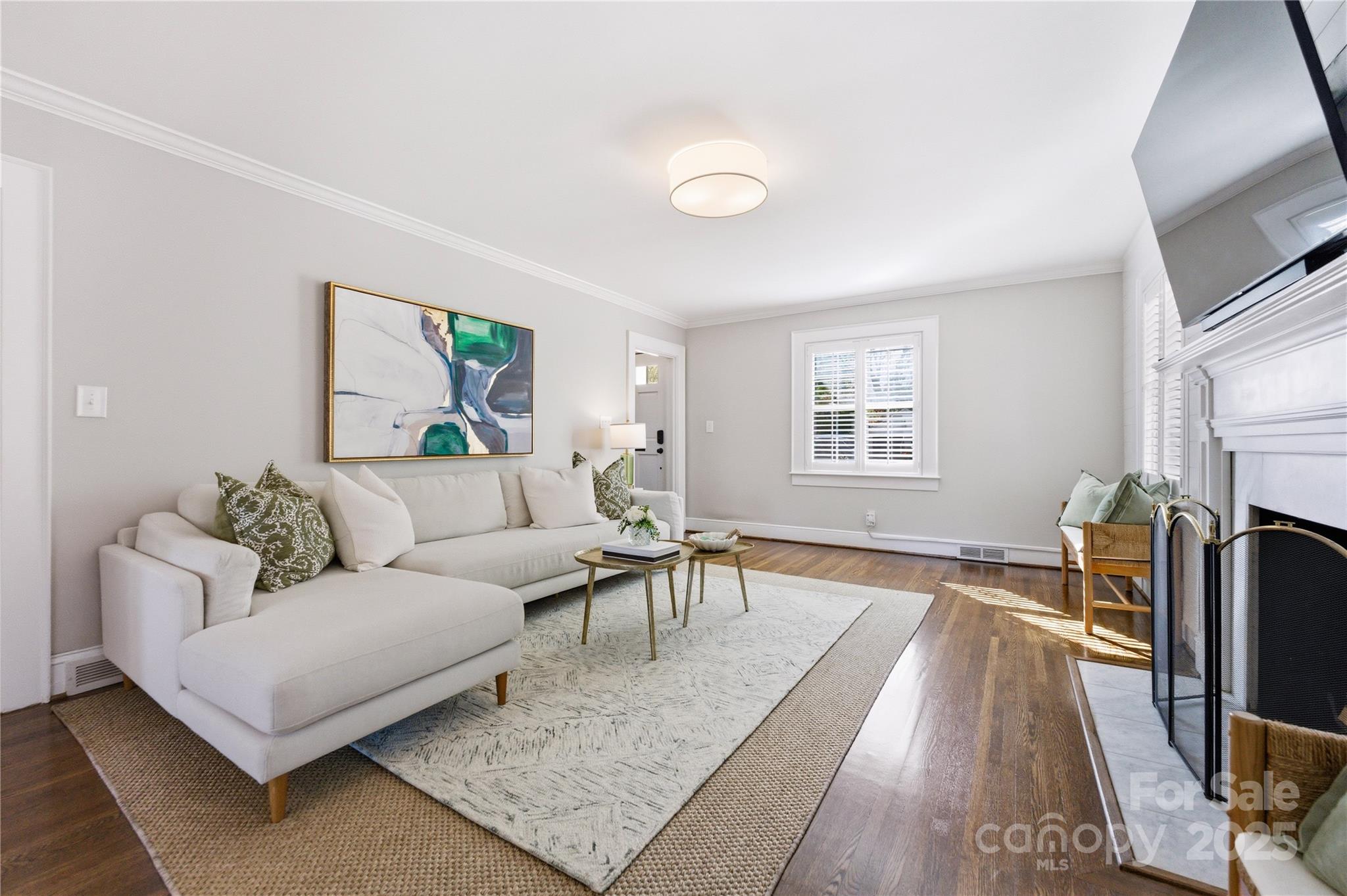 1305 Lilac Road Charlotte, NC 28209 - Photo 4 of 48 a living room with furniture and a flat screen tv