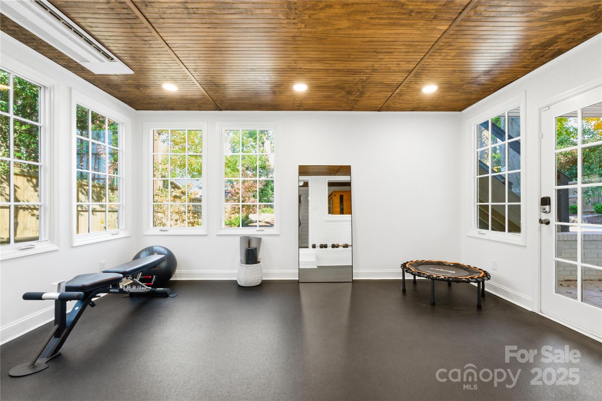 1305 Lilac Road Charlotte, NC 28209 - Photo 42 of 48 a living room with furniture and large windows