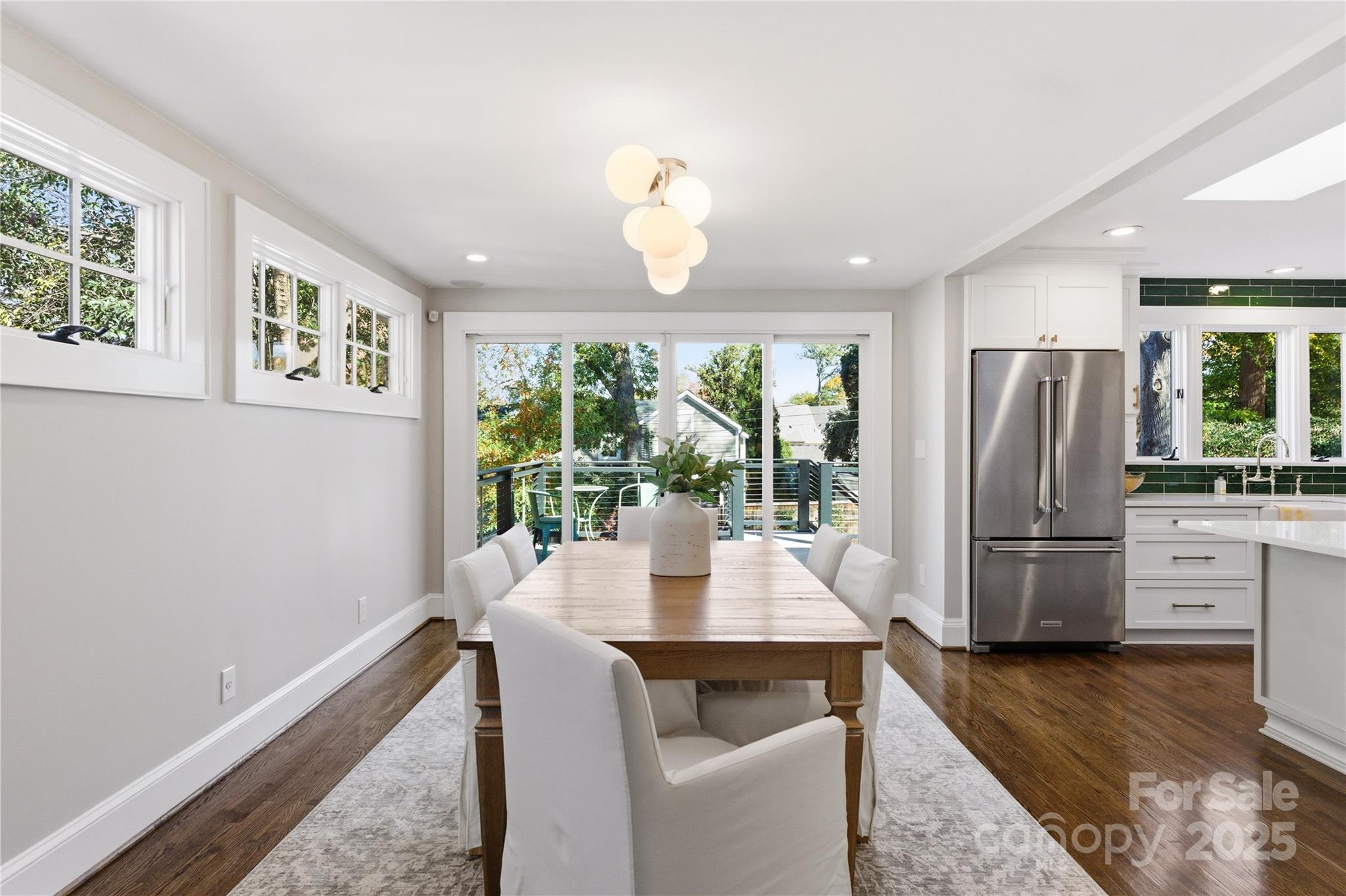1305 Lilac Road Charlotte, NC 28209 - Photo 6 of 48 a dining room with furniture and a window
