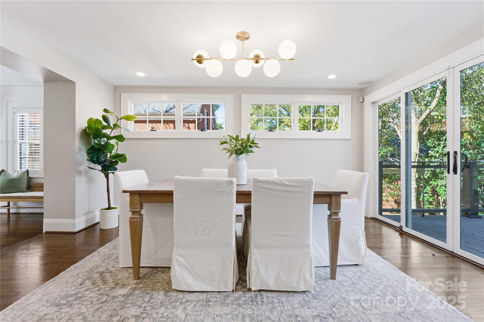 1305 Lilac Road Charlotte, NC 28209 - Photo 7 of 48 a living room with furniture a window and a potted plant
