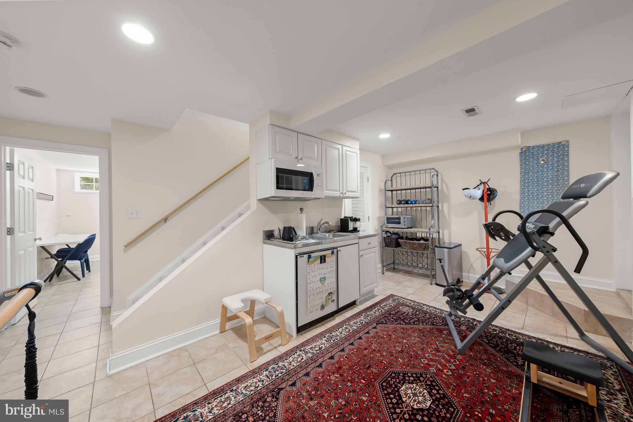 1819 37th Street Northwest Washington, DC 20007 - Photo 20 of 24 Lower level rec room w/ kitchenette