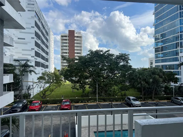 a kitchen with a stove top oven and cabinets