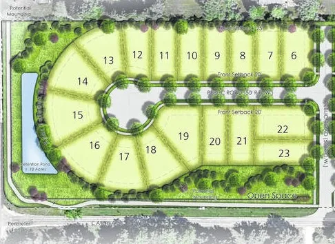 an aerial view of residential houses with city view