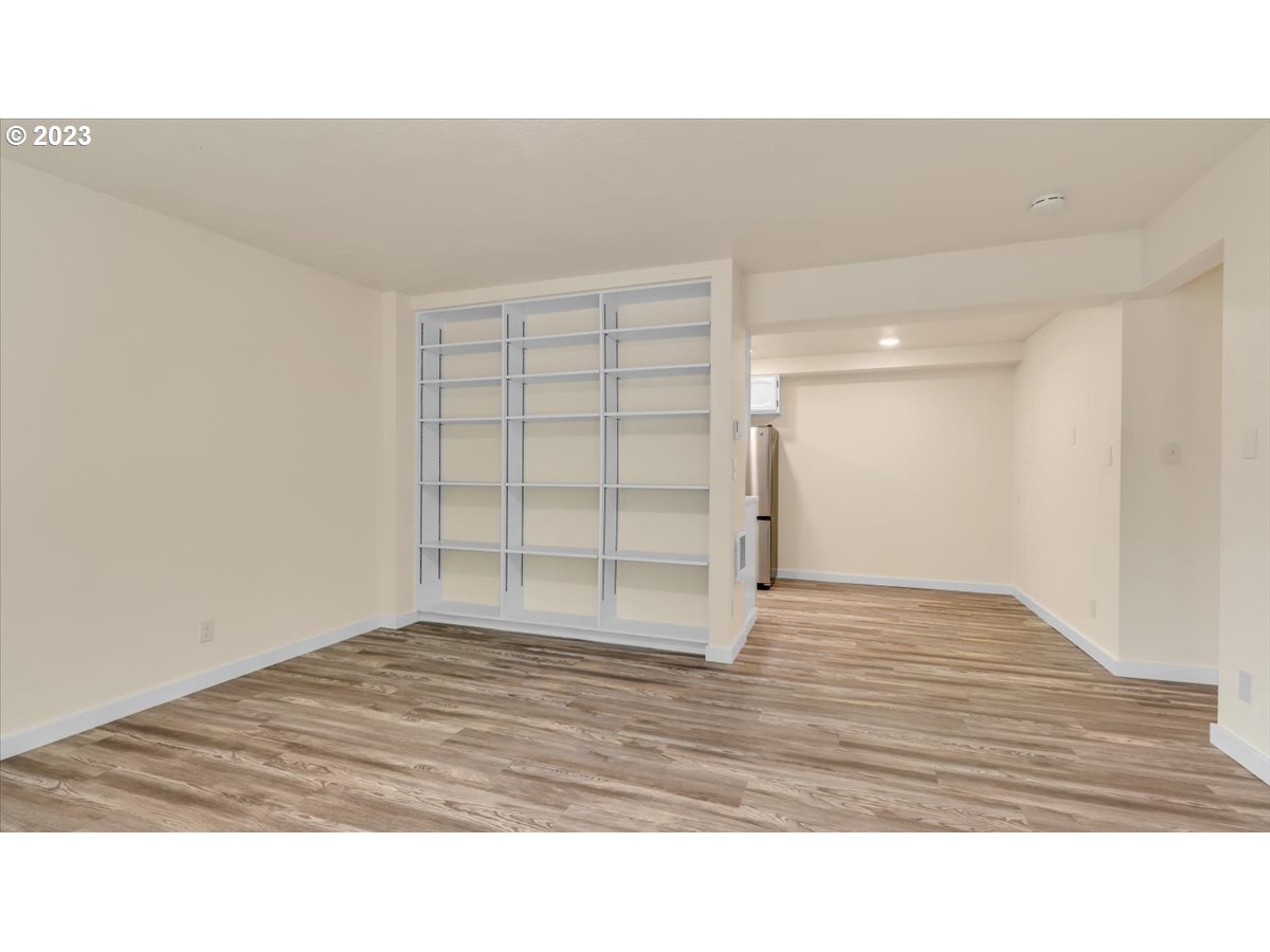 1318 15th Street Oregon City, OR 97045 - Photo 24 of 38 a view of an empty room and wooden floor