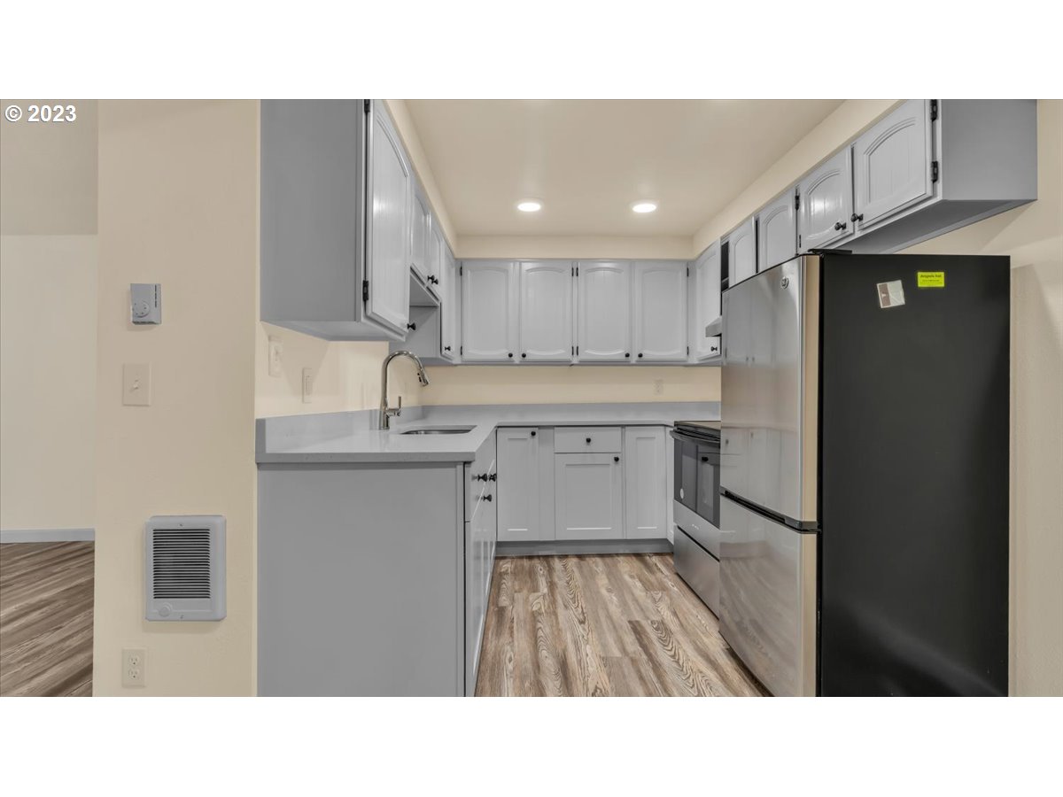 1318 15th Street Oregon City, OR 97045 - Photo 25 of 38 a kitchen with a sink stainless steel appliances and cabinets